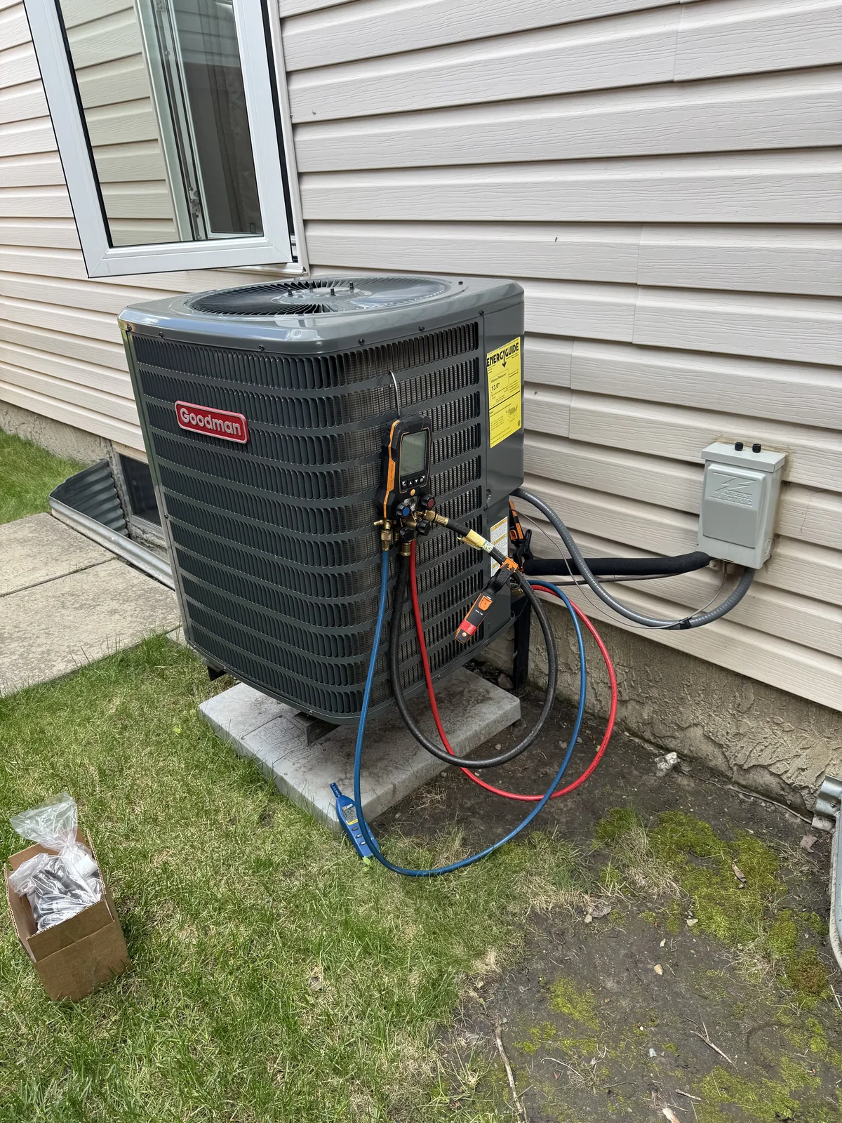 Air conditioner performance checked with professional service gauges