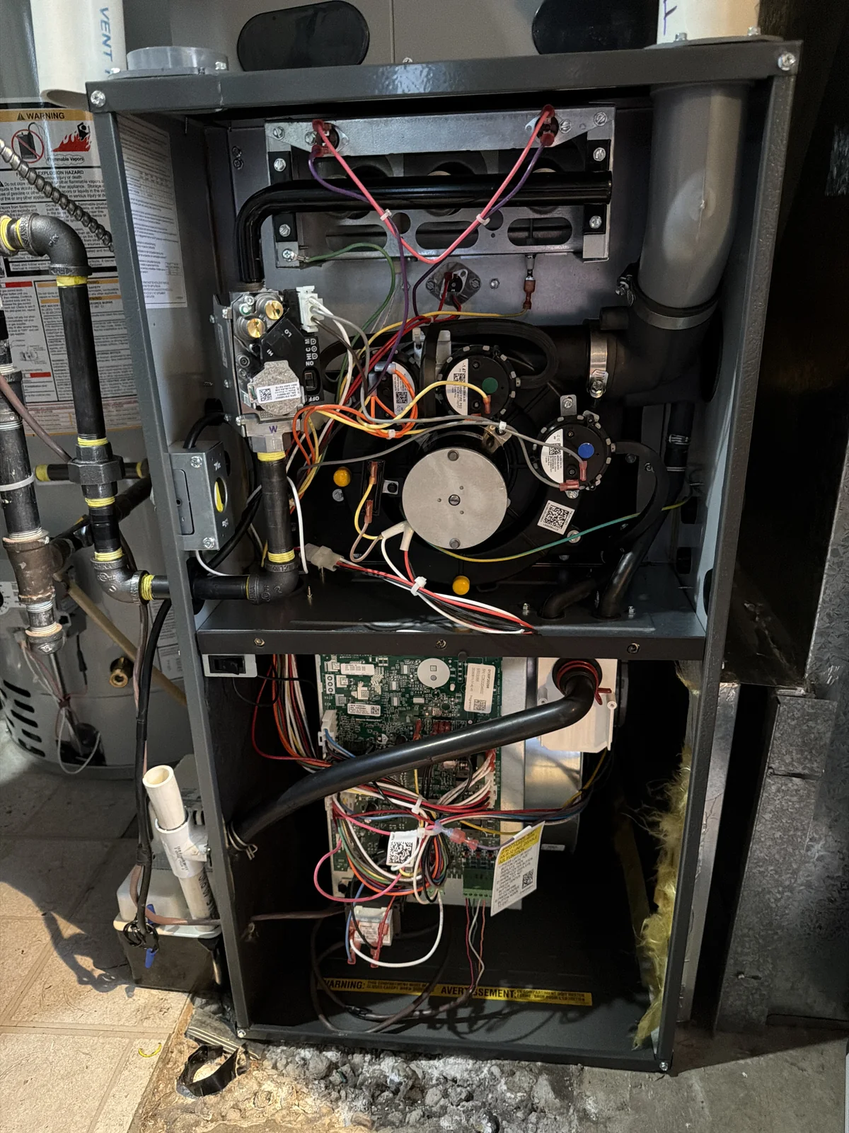 Furnace controls and internal components inspected during a repair visit