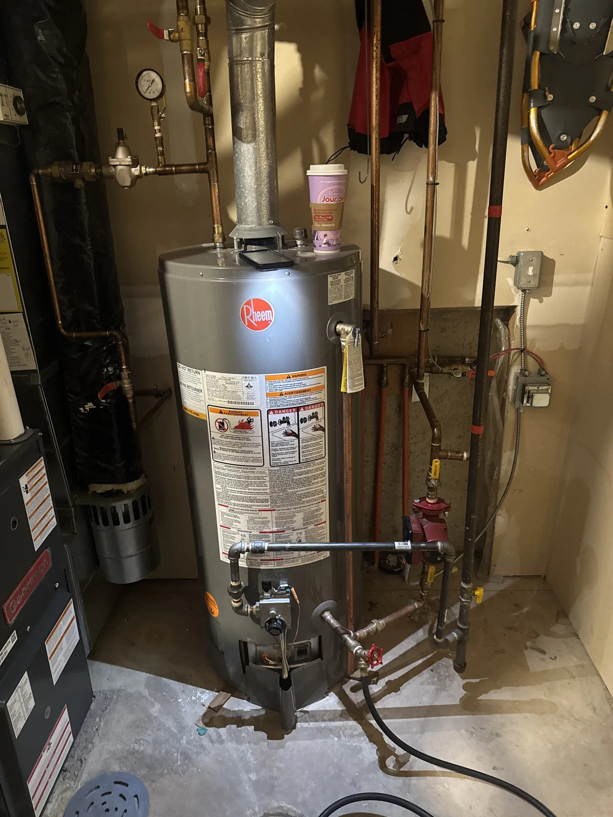 Tank-style hot water heater replacement in a Chestermere home